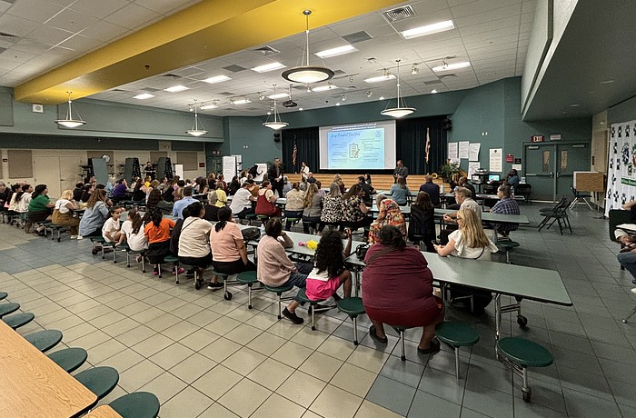 Parents, teachers and community members gather in the cafeteria Sept. 18 to voice concerns in a school district-led meeting.