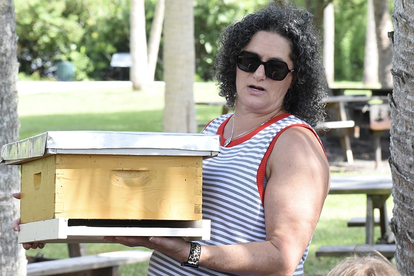 Beekeeper Lauren Hofing showcases the equpment she uses to keep bees.