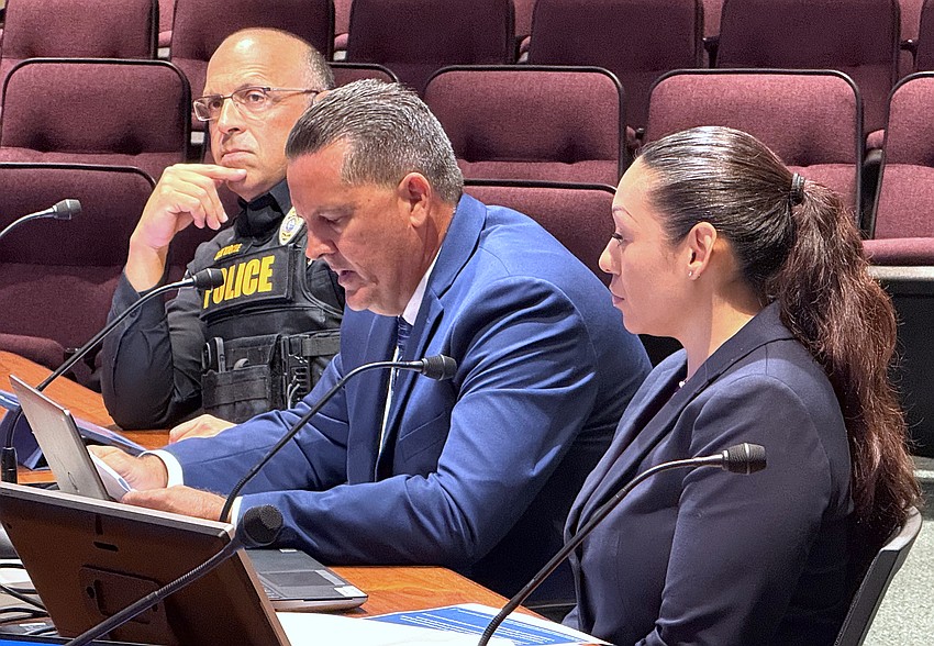 Sarasota Police Department Real-Time Operations Center Manager John Lake (center) speaks to commissioners with Chief Rex Troche and Crime Analyst Monica Galeano-Bush.