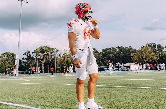 Devin Mignery stands on the field during Cardinal Mooney football's pregame warm-ups. The senior quarterback is headed to Stanford next fall, but has yet to start in 2025.