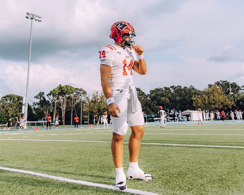 Devin Mignery stands on the field during Cardinal Mooney football's pregame warm-ups. The senior quarterback is headed to Stanford next fall, but has yet to start in 2025.