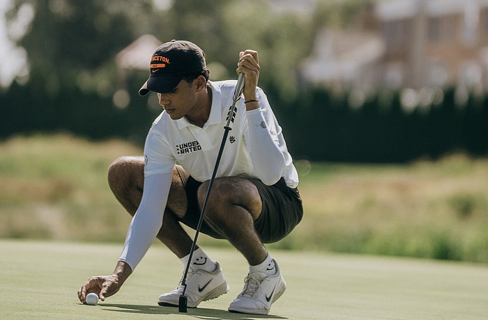 Jordan Brown sets down his ball on one of the greens at New Jersey's Liberty National Golf Club. The Princeton men's golf commit finished sixth at the 2025 Curry Cup Championship.