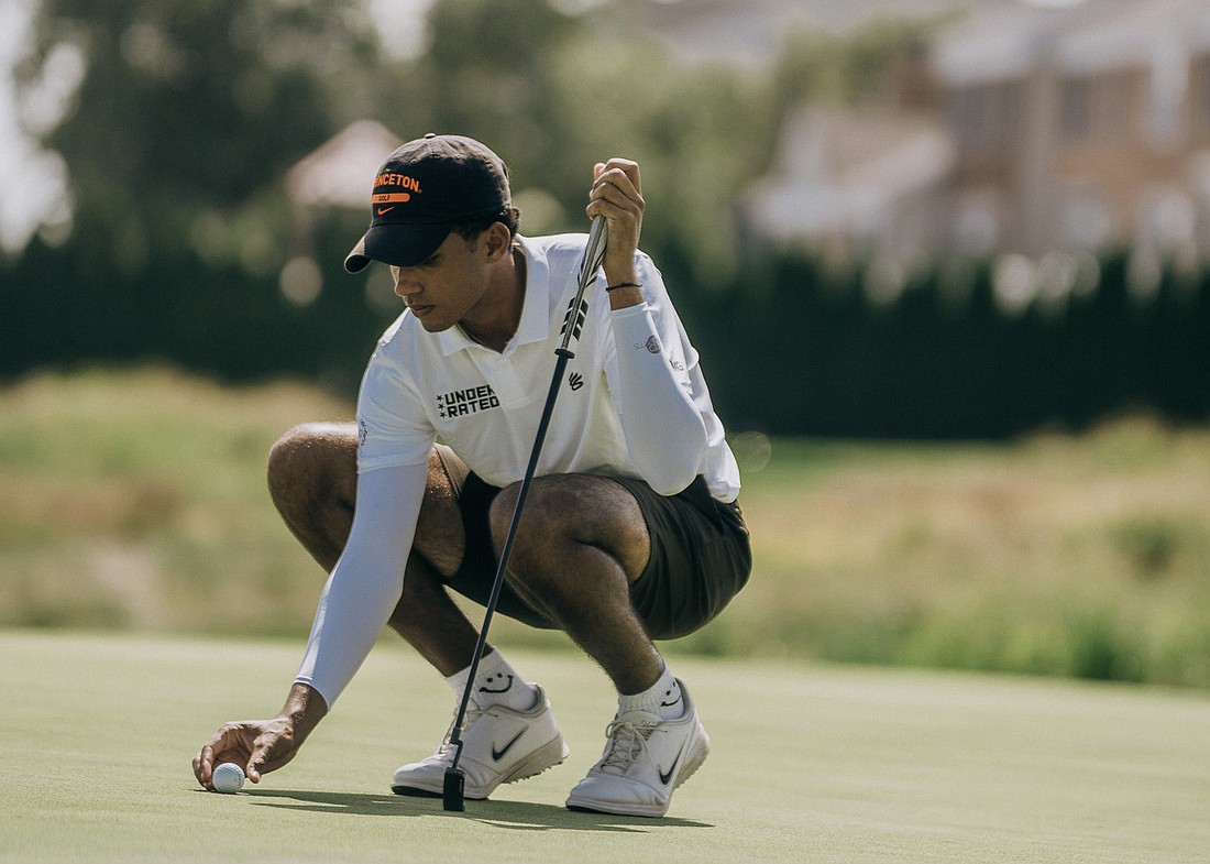 Jordan Brown sets down his ball on one of the greens at New Jersey's Liberty National Golf Club. The Princeton men's golf commit finished sixth at the 2025 Curry Cup Championship.