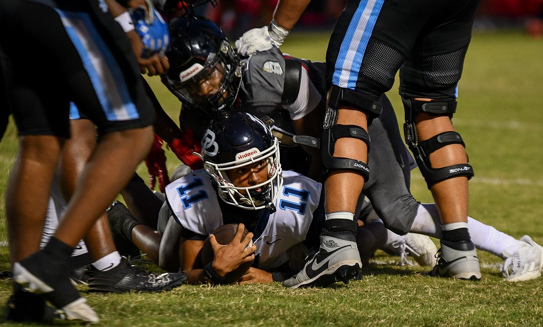 Dr. Phillips quarterback Camren West was tackled by Ocoee's defense.