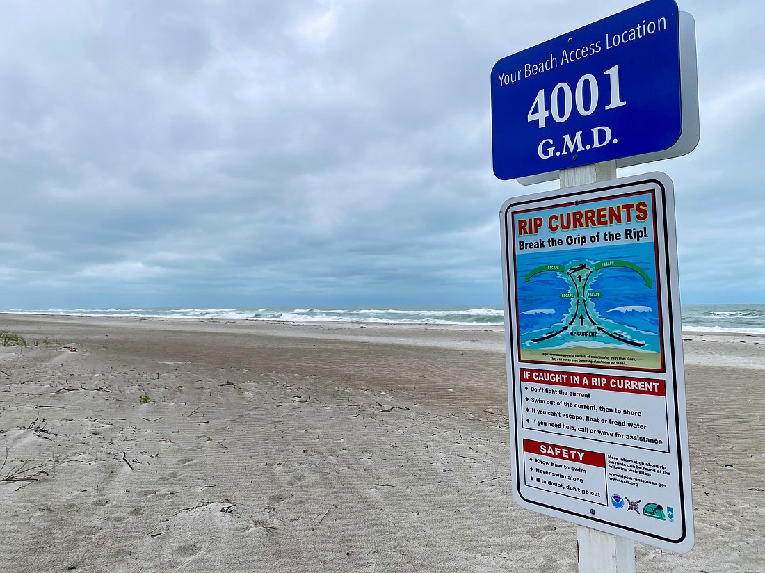 Signs on Longboat Key's public beaches caution swimmers about the dangers of rip tides.
