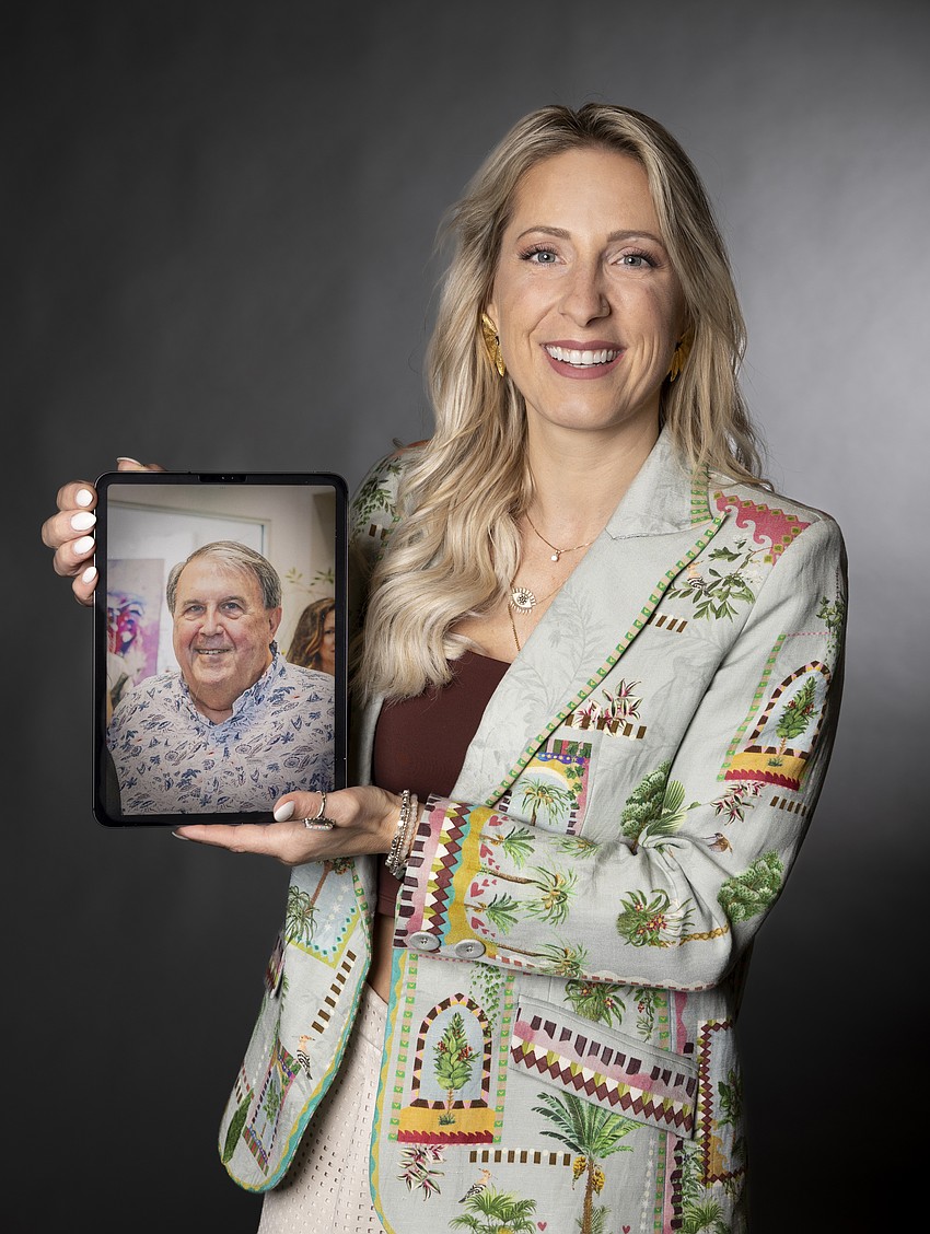 Alissa Silvers with a photo of her mentor Jon Stuart.