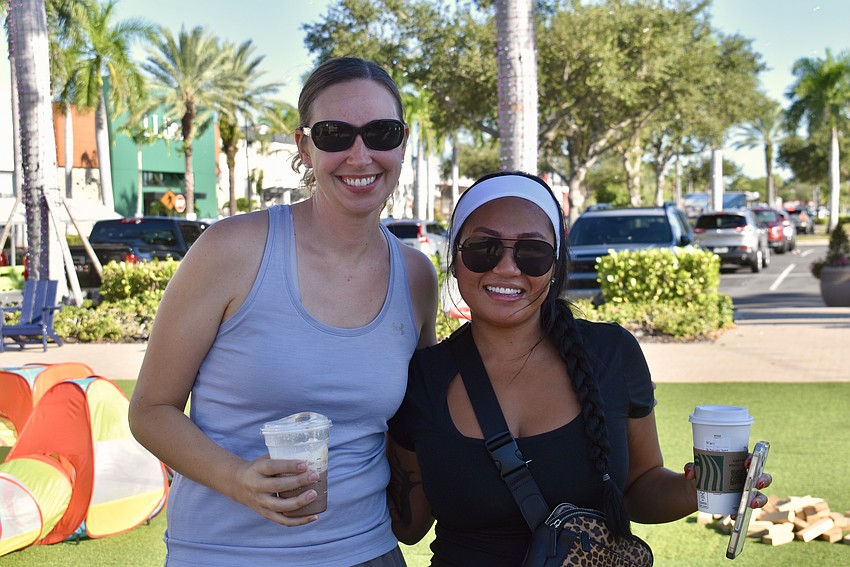 Former neighbors Kari Evans and Meriam Silva drink coffee and catch up while the kids play.