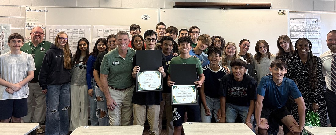 Holding their certificates as National Merit Scholarship semifinalists are Flagler Palm Coast High School seniors Adniel Alonzo (left) and Mitchell Spencer Edelstein. Courtesy photo