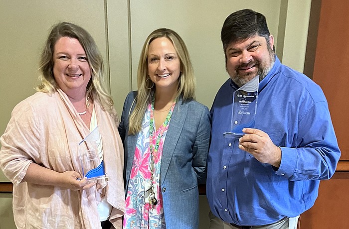 Outgoing Visit Sarasota County Board of Directors members Kara Morgan (left) and Mark Gordon with VSC President and CEO Erin Duggan.