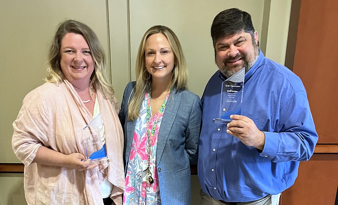 Outgoing Visit Sarasota County Board of Directors members Kara Morgan (left) and Mark Gordon with VSC President and CEO Erin Duggan.