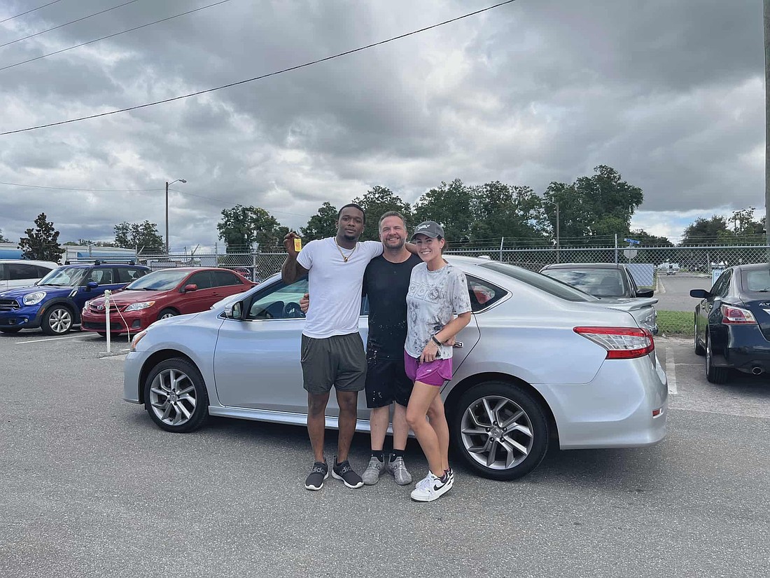 Jeremy and Angela Waller helped Gaboreius Baldwin,left, purchase the car.