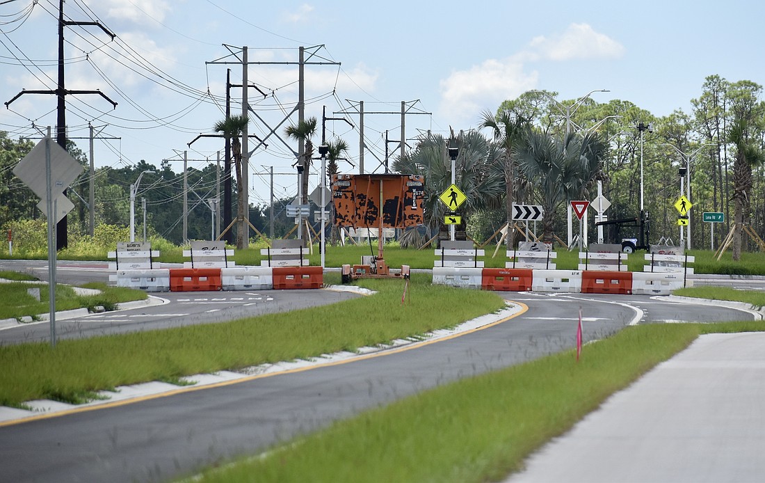 The barricades heading north on Lena Road from the roundabout at 44th Avenue East will be removed Oct. 1.