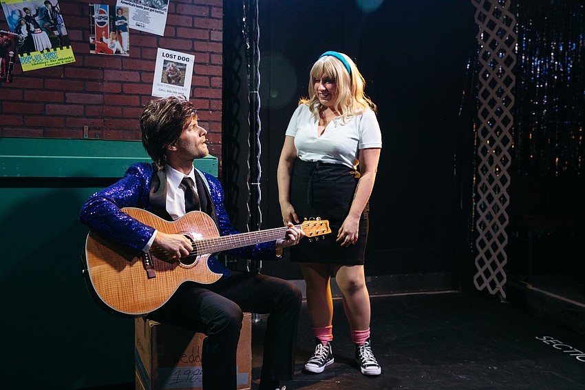 Christos Nicholoudis and Lacy Knispel share a tender moment in Sarasota Players'