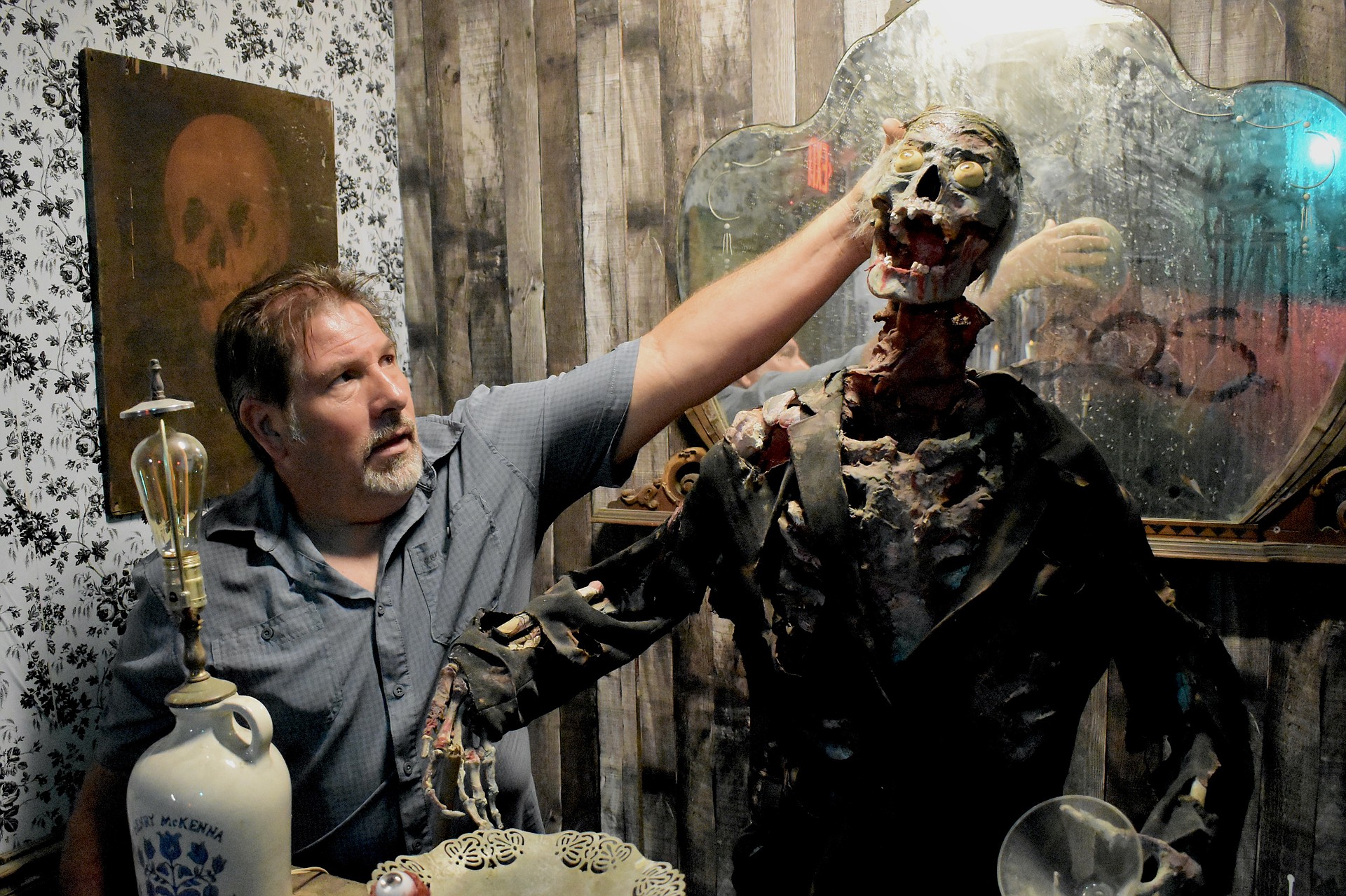 Stan Ambro adjusts the animatronic of the bartender.