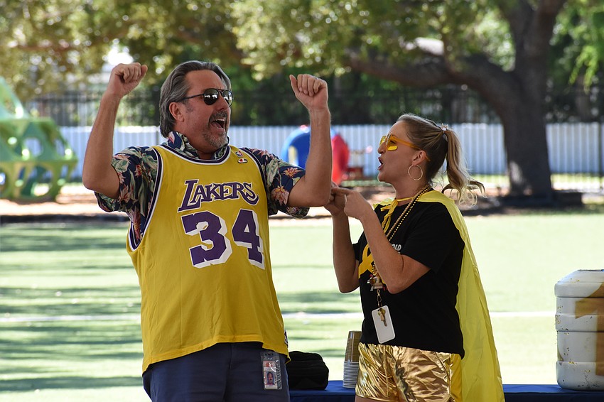 Teachers John Freeman and Ashlee Middleton help rally the students.