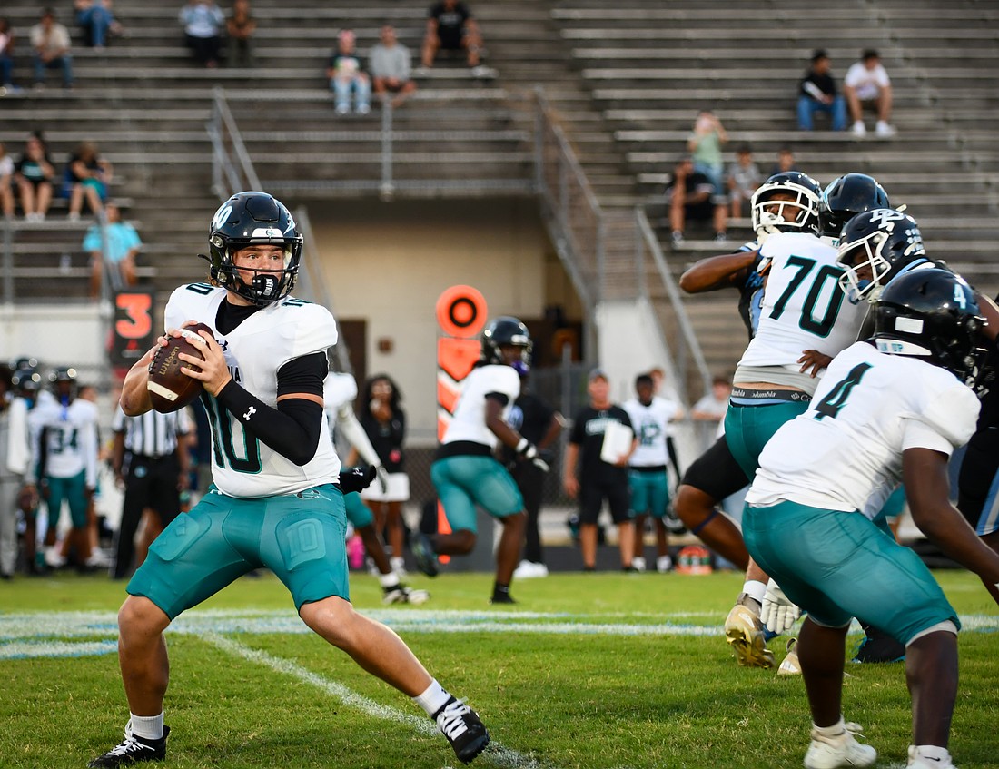 Olympia's quarterback Noble Davis looked to throw the ball against Dr. Phillips' defense.