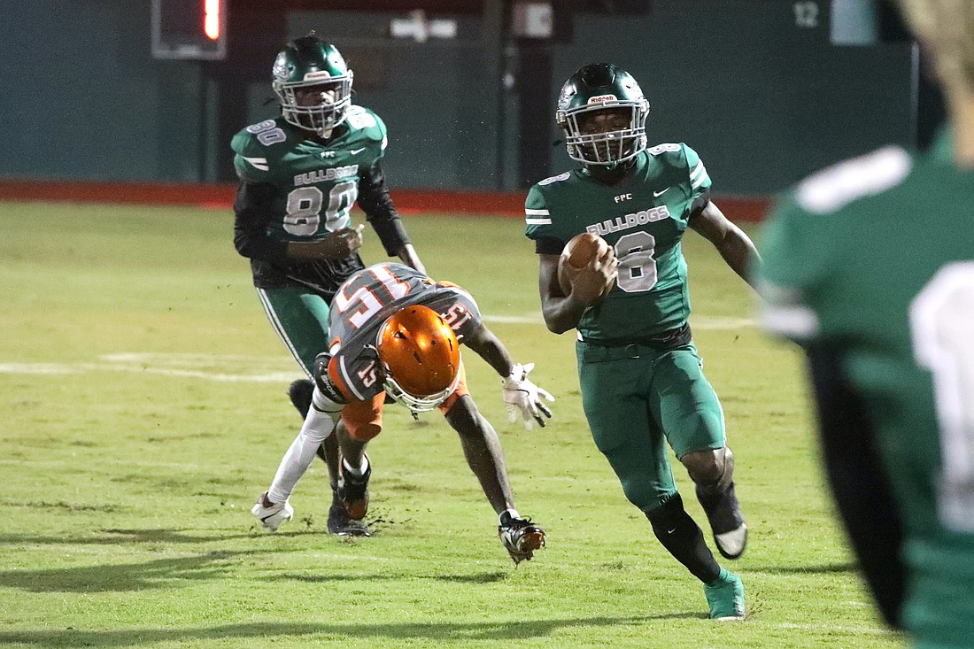 La'Darius Simmons, here running a quarterback keeper against University on Sept. 26, ran for 105 yards against DeLand on Oct. 10. File photo by Brent Woronoff