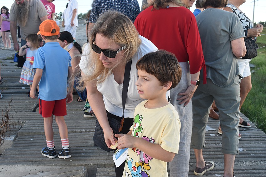 Lakewood Ranch's Stacy Feldbaum tells her son Zev, 5, that they are not feeding ducks, but instead letting go of the sins of last year. Zev says he wants to be better about cleaning up and being nicer to his brothers.