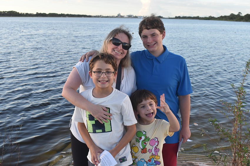 Lakewood Ranch's Stacy Feldbaum and her sons Sasha, 14, Tristan, 9 and Zev, 5, attend the Tashlich ceremony by Temple Emanu-El.
