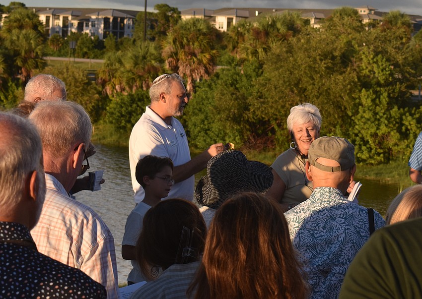Temple Emanu-El's Rabbi Michael Shefrin and Rabbi Mimi Weisel lead the 
Tashlich ceremony, which is symbolic for letting go of sins of the past year.