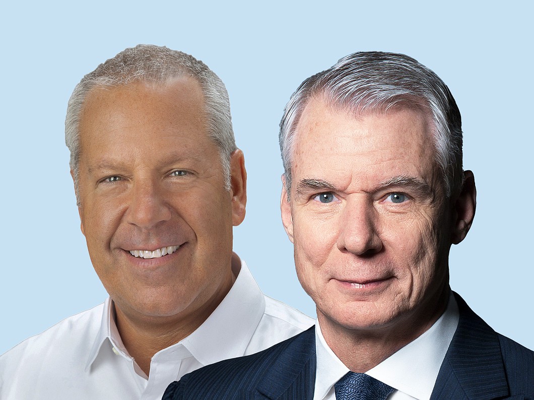 Former CSX President and CEO Joe Hinrichs, left, and the railroad company's new CEO, Steve Angel. Jacksonville-based CSX announced the transition Sept. 29.