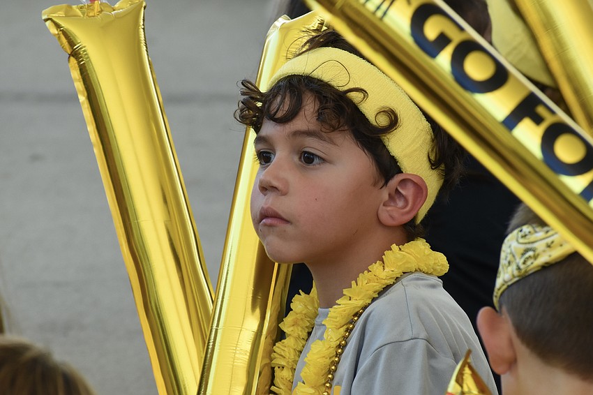 Kindergartener Alex Gomez watches as the rally gets underway.