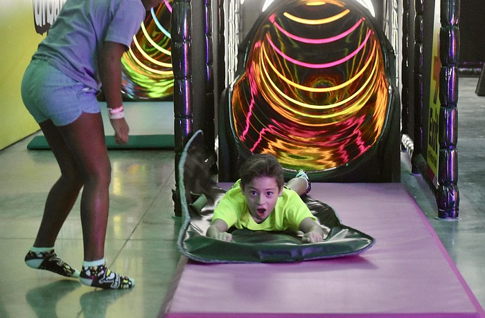 Myakka City's Bennett Simunovic, 8, wasn't expecting to fly out of the slide so fast, but he doesn't mind.