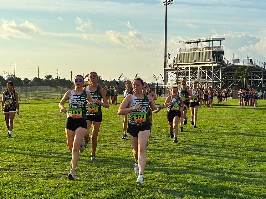 Lakewood Ranch girls' cross country runs at the Aug. 30 Venice Invitational. Mustang juniors Addison Shear and Caroline Bartlomiejczuk have felt the heat ever since team practices began in late July.