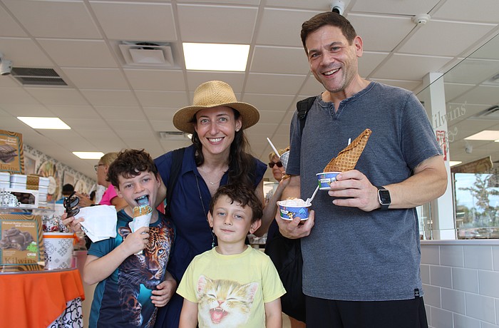Wess, 8, Samantha, Everette, 5, and Dan Becker try out their favorite flavors of ice cream at the grand reopening of the Kilwins sweet shop on St. Armands Circle on Sept. 27.