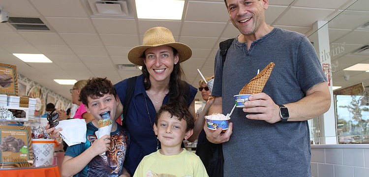 Wess, 8, Samantha, Everette, 5, and Dan Becker try out their favorite flavors of ice cream at the grand reopening of the Kilwins sweet shop on St. Armands Circle on Sept. 27.