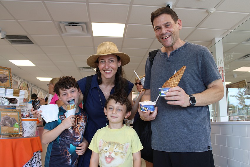 Wess, 8, Samantha, Everette, 5, and Dan Becker try out their favorite flavors of ice cream at the grand reopening of the Kilwins sweet shop on St. Armands Circle on Sept. 27.