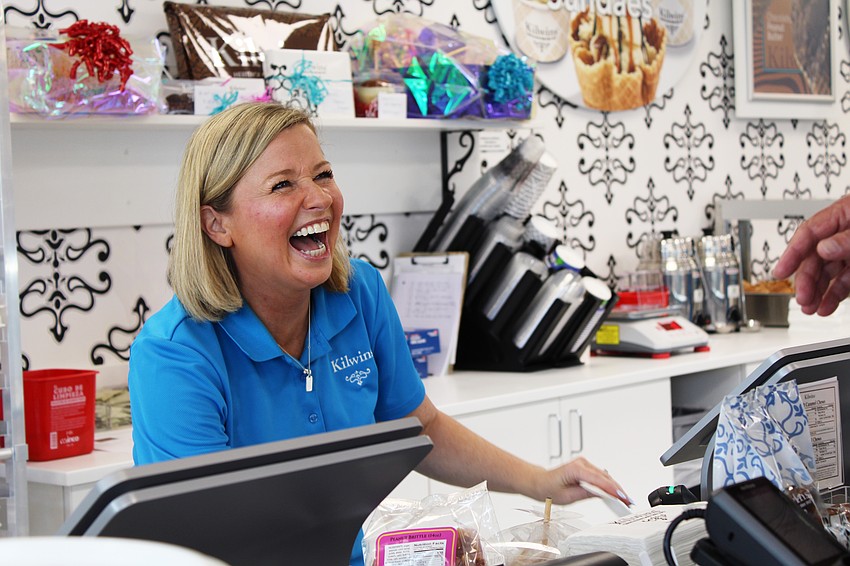Erica Escalera, vice president of company stores at Kilwins, shares the joy of reopening the St. Armands Circle location with customers on Sept. 27. The store reopened just ahead of the one-year anniversary of hurricanes Helene and Milton.