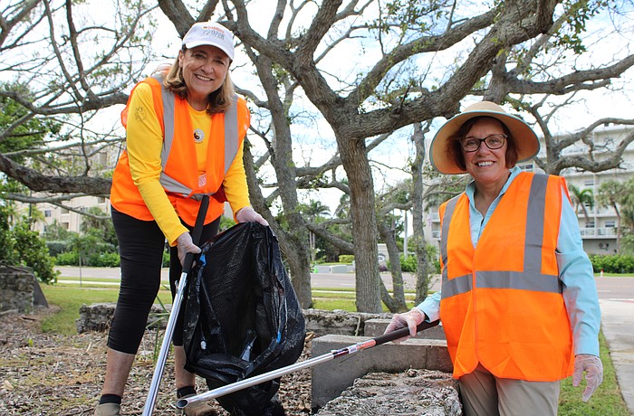 Kelli Veit and Mindy Brandt help with a community cleanup on Longboat Key as part of Temple Beth Israel's new tashlich tradition.