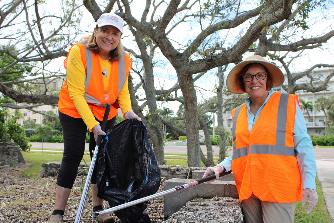 Kelli Veit and Mindy Brandt help with a community cleanup on Longboat Key as part of Temple Beth Israel's new tashlich tradition.