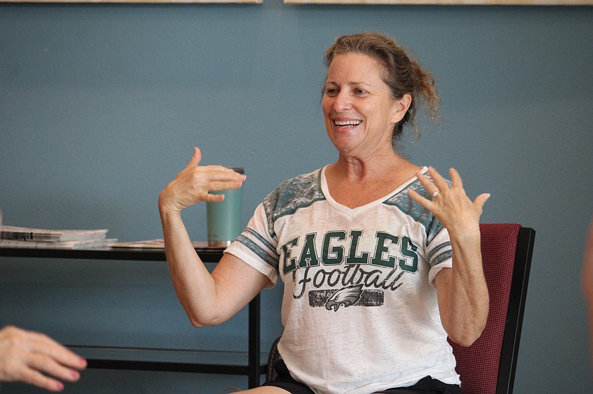 Instructor Suzy Brenner encourages participants to shake loose any hand tension during her 