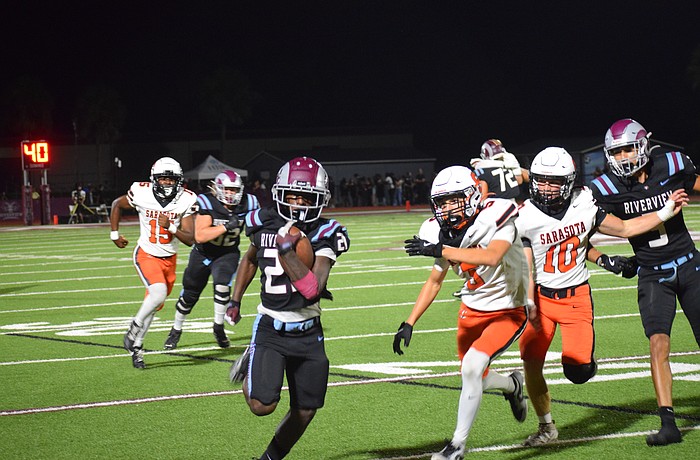 Toryeon James (21) of Riverview football sprints down the sideline en route to a touchdown against Sarasota. The junior ran for nearly 300 yards in the team's Week 6 defeat of its longtime rival.