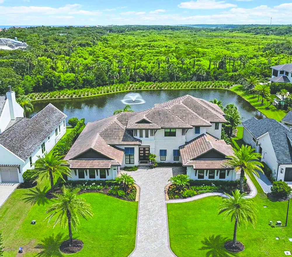 The home has four bedrooms and 4.5 baths, a home office, upstairs entertaining space, Sub-Zero paneled refrigerator and a 300-bottle wine racking system, patio and pool.
