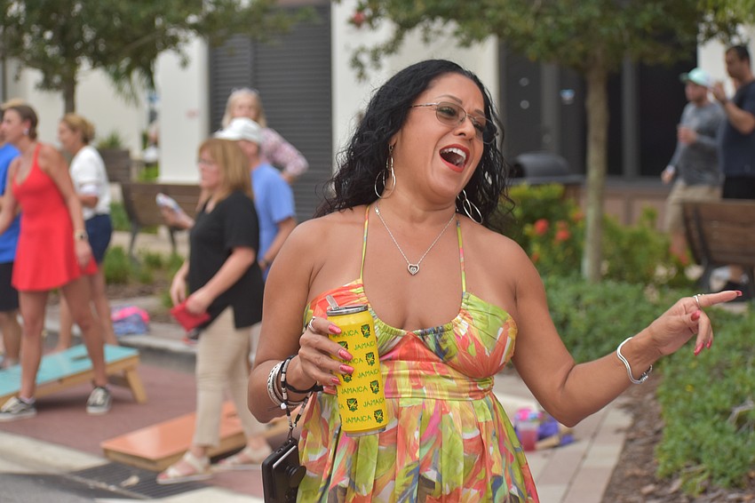 Sarasota's Emily Lugo says she wants to dance all night and is hungry because of the smell of good food in the air.