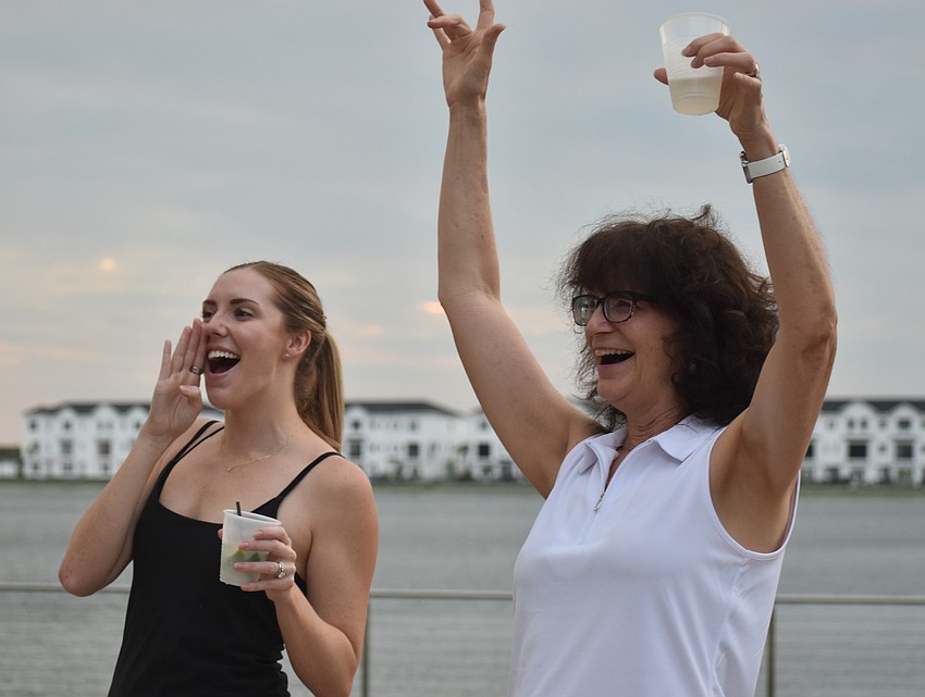 Lakewood Ranch's Payton Marshall, along with her mother-in-law Marie Marshall, cheer on No Filter. The band played at her wedding on June 22, 2024.