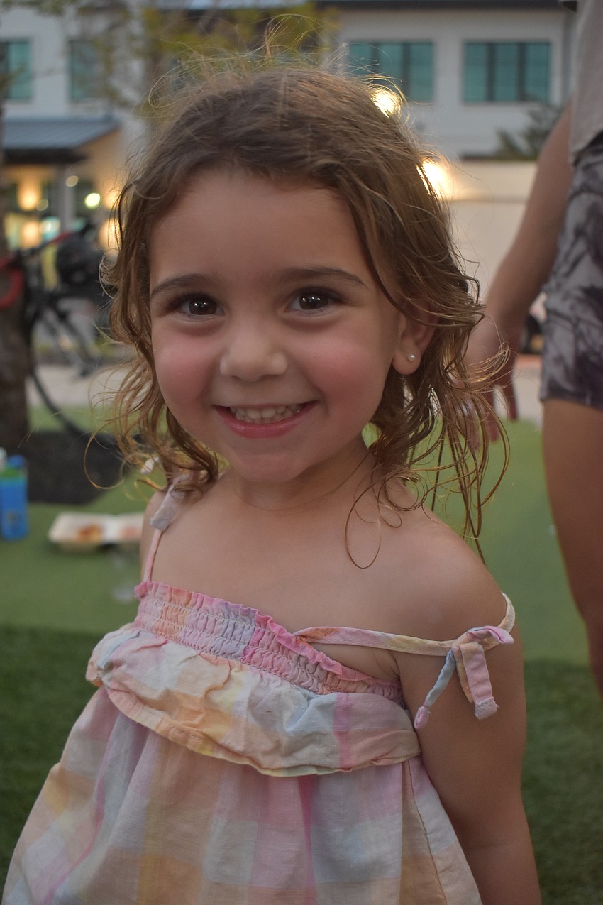 Lakewood Ranch's Nevada Diorides, 3, pauses to give a quick smile before running to get her energy out with friends.