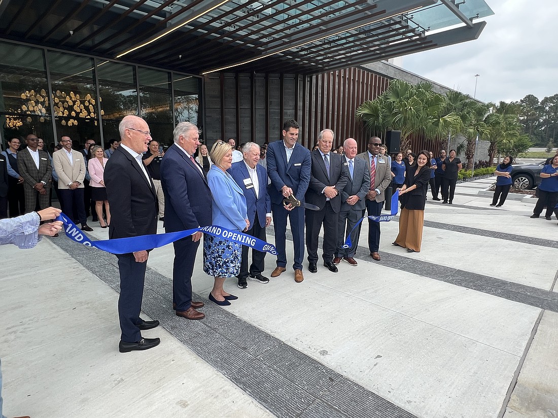 Hilton Jacksonville at Mayo Clinic General Manager Jayson Zimmer cuts the ceremonial ribbon to officially open the hotel on Oct. 1.