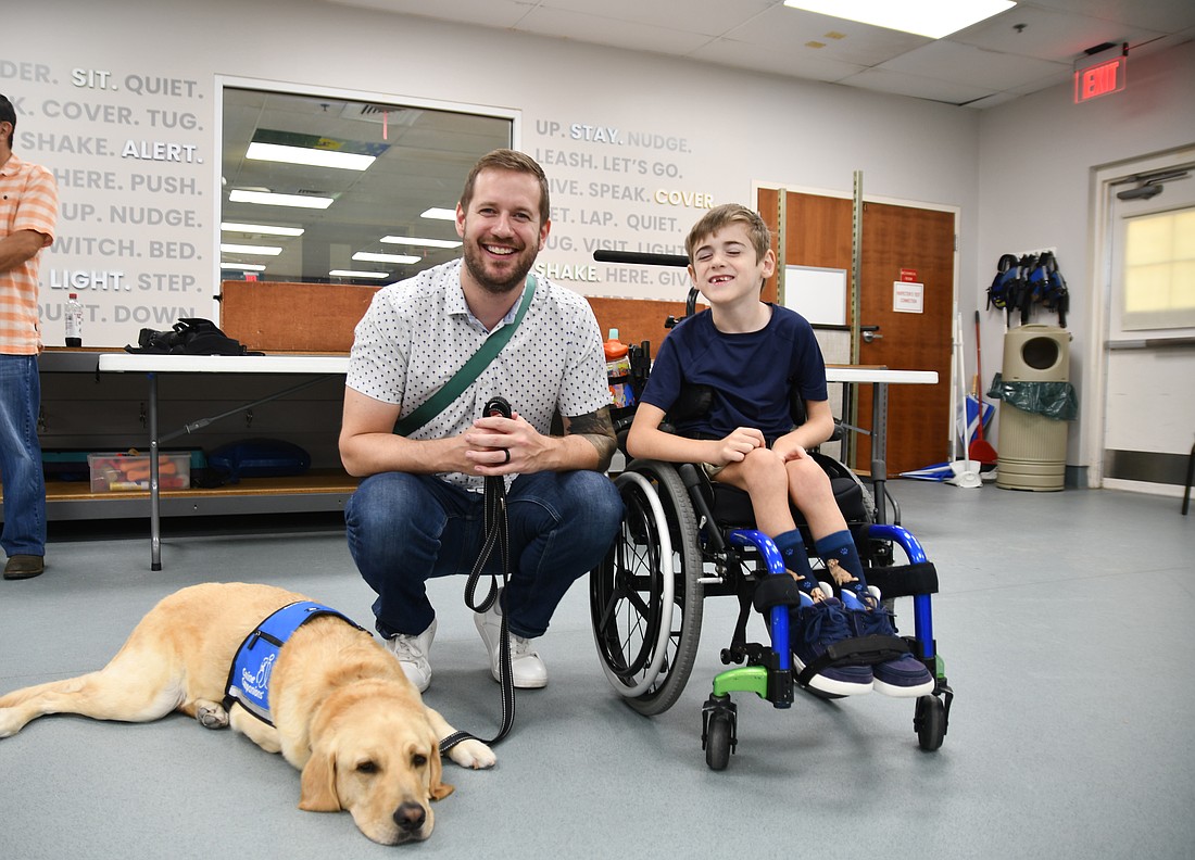 Jeremy Widbin and his son, Jack, said their lives have been changed by Canine Companions.