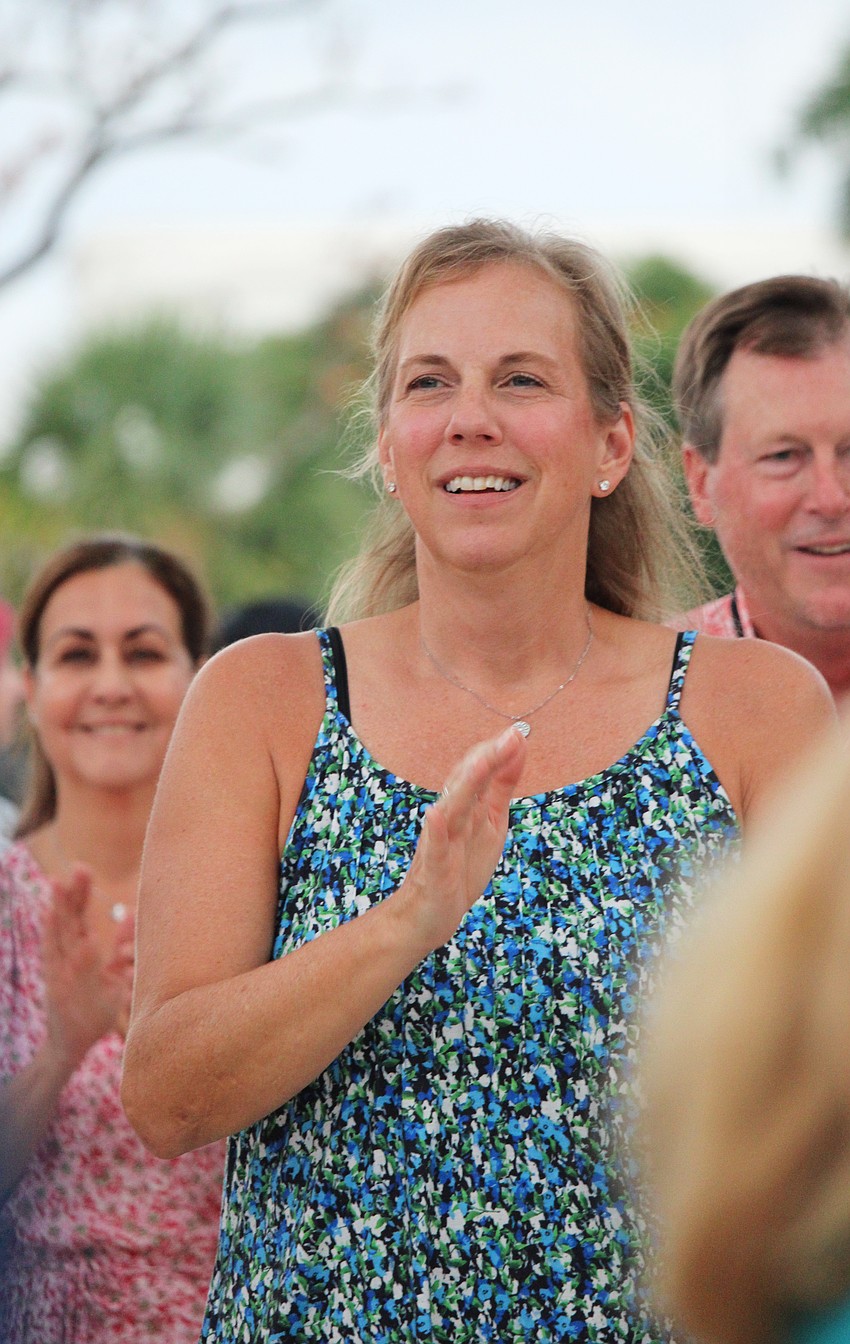 Anniversary celebrant Karen Haff counts out the steps to a salsa on Oct. 1 at The Bay. The park has a full month of free public events planned to celebrate.