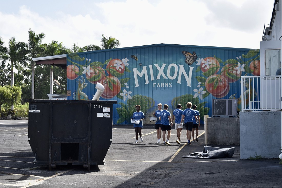 Students from The Out-of-Door Academy volunteer at Mixon Fruit Farms Oct. 3.
