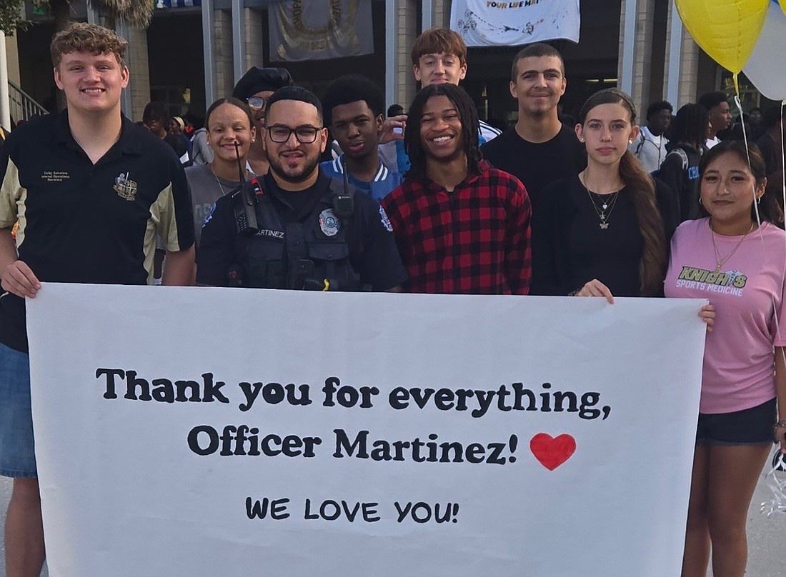 Ocoee High School students thanked Officer Eladio Martinez for his service as the school resource officer as they said goodbye. Martinez is preparing for an overseas deployment.