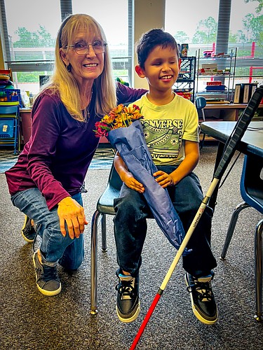 Old Kings Elementary School paraprofessional Suzanne Carter works one-on-one with fifth grader Maverick Carter. Flagler Schools photo