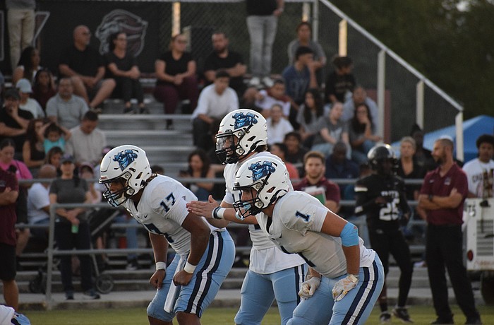 Allen Clark (left), Edouard Chaput (center) and Cameron Yates (right) line up in the backfield. The three featured prominently in Out-of-Door Academy football's commanding win over Faith Christian in Week 8.