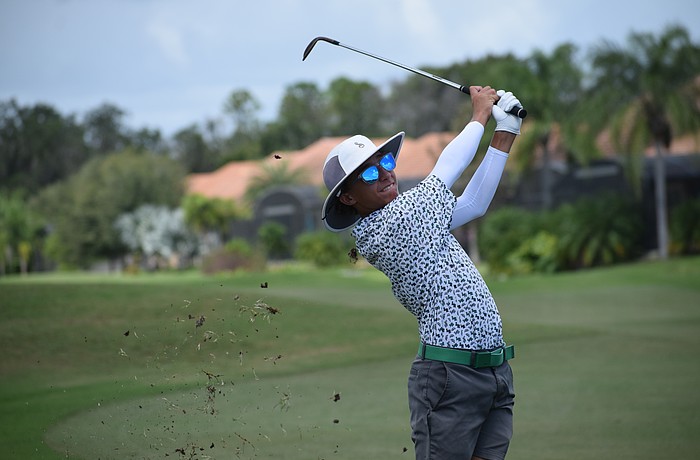 Will Thomas follows through on an approach shot at the Qdoba Tournament of Champions on Oct. 3 in Davenport. The sophomore is in his first year on varsity for the new-look Mustangs.