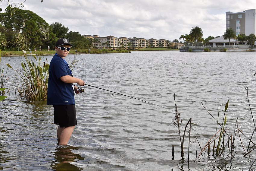 Myakka City's 11-year-old Mike Helm isn't scared of wet sneakers.