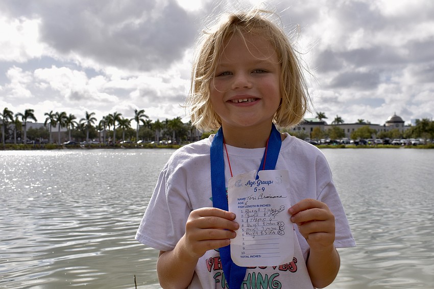 Sarasota's Tori Bruinsma, 6, catches several bluegills and one turtle. The turtle is logged and measured but doesn't count towards the 